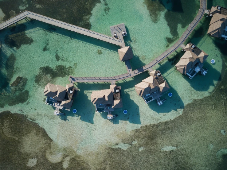 a aerial view of some buildings near water