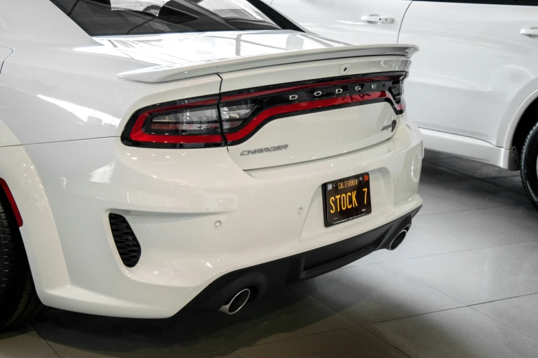 the back end of a white dodge charger