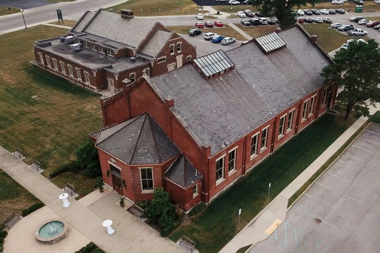 an aerial s of a building in the middle of town