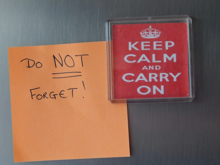 a magnet with the message keep calm and carry on
