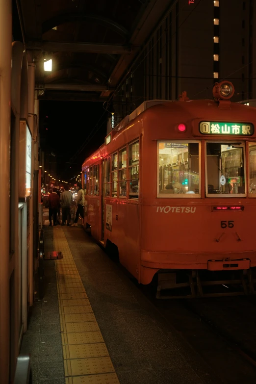 there are many people walking towards a trolley