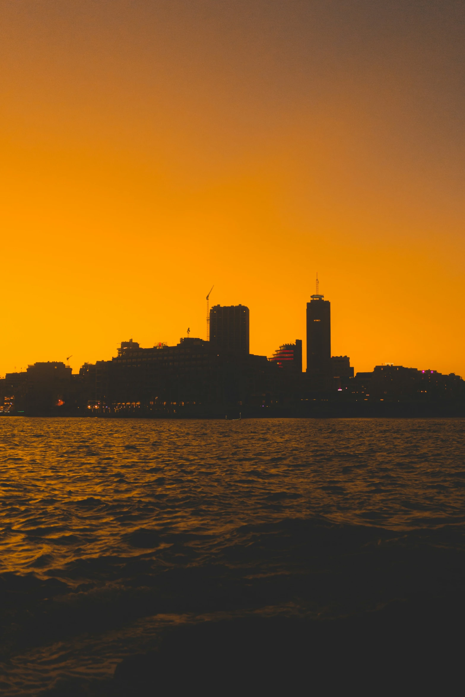 a sunset po, with the city skyline in the background