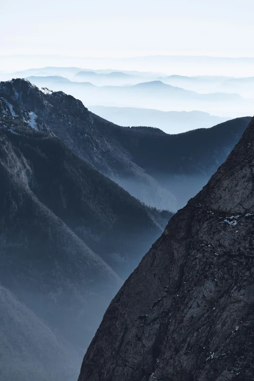 view of mountain tops on a misty day