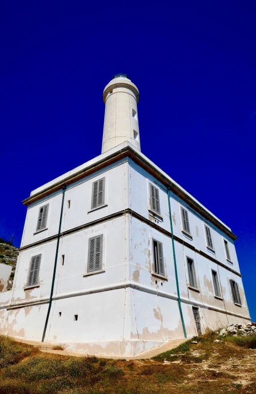 an old building sits out against the blue sky