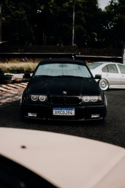 a couple of cars are parked in a parking lot