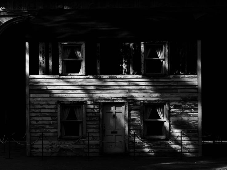 the shadow of a house's shutters is cast on it