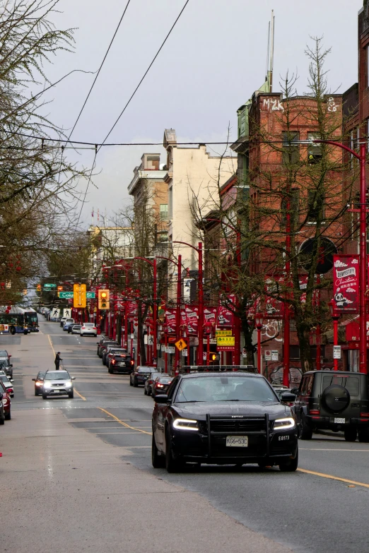 cars lined up in front of a red and white building