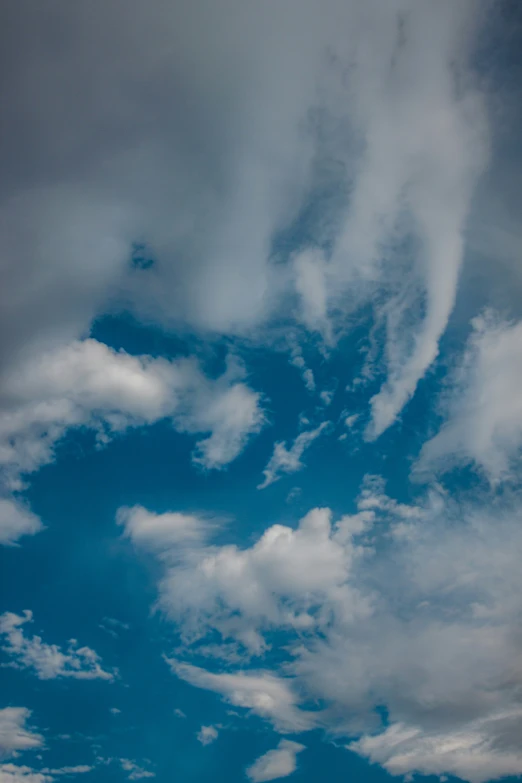 some very large pretty clouds in the sky