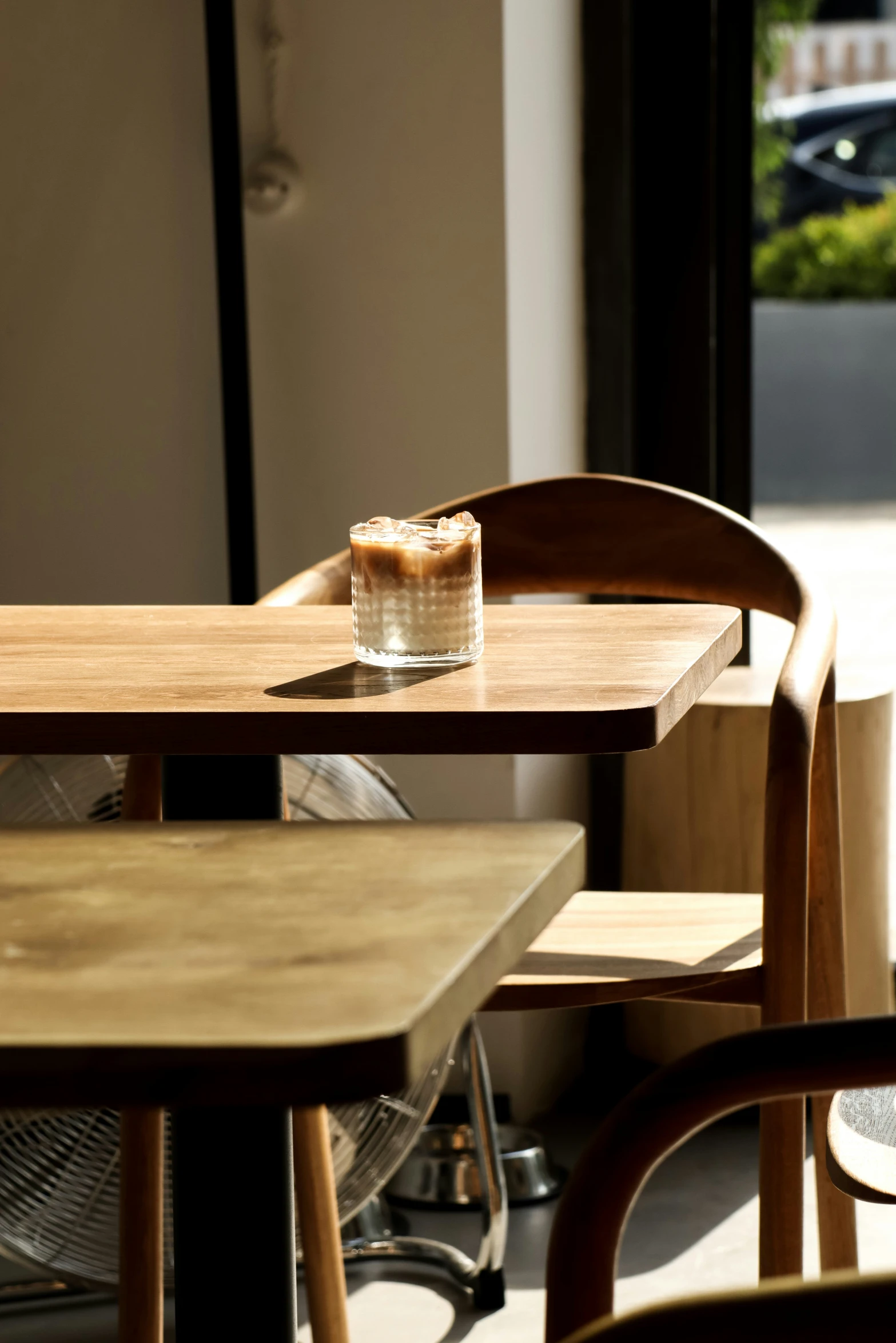 two empty glasses are sitting on a wooden table