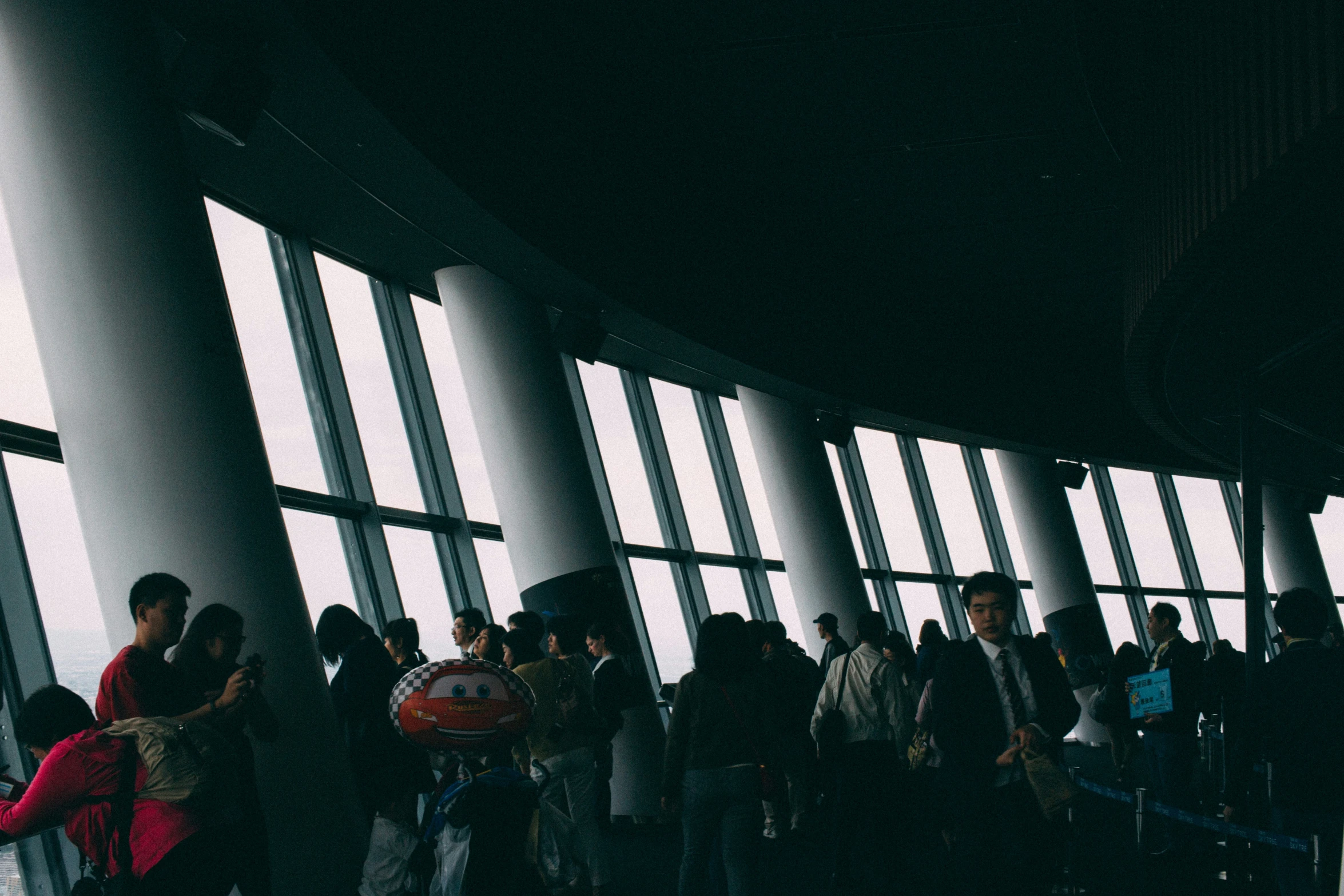 people lined up near the window in a room