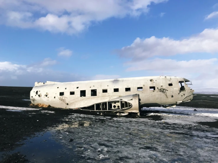 this large plane has been abandoned on the beach