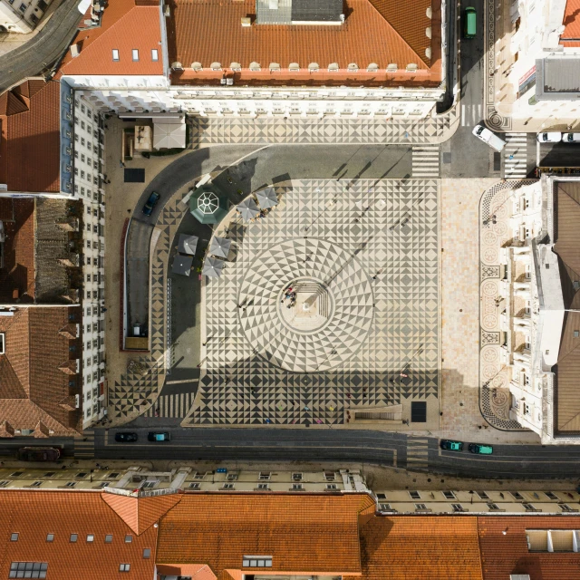 an aerial view of rooftops with large tile windows