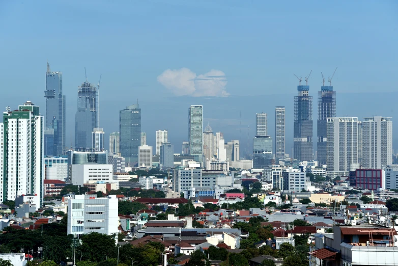 a view of an urban area with skyscrs in the background