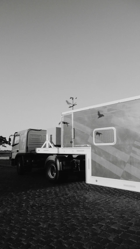 a truck pulls up to a mobile storage area