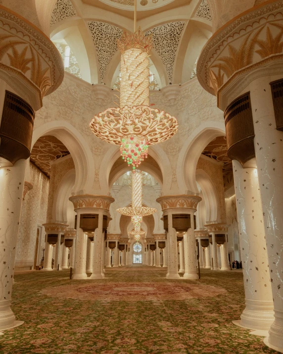 the large ceiling is decorated with intricate white columns