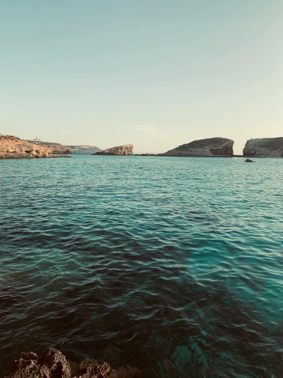 the view of water and land from the side of the water