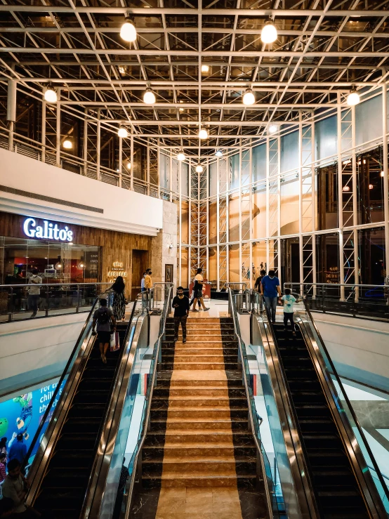 some escalators in a big open building