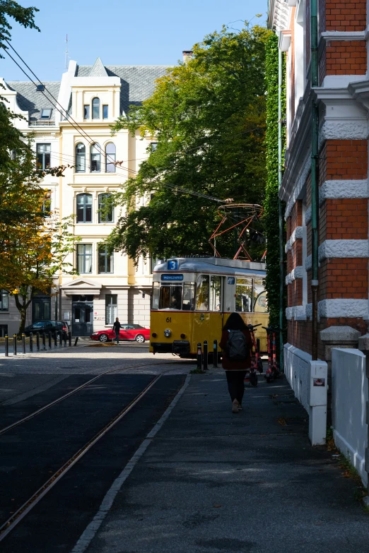 a person walking in the middle of an empty street