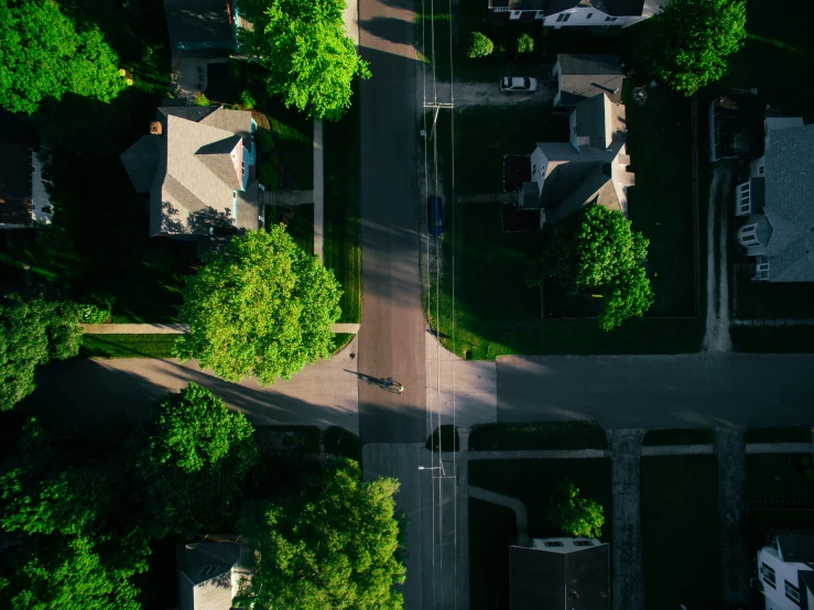 aerial view of two streets and houses near one another