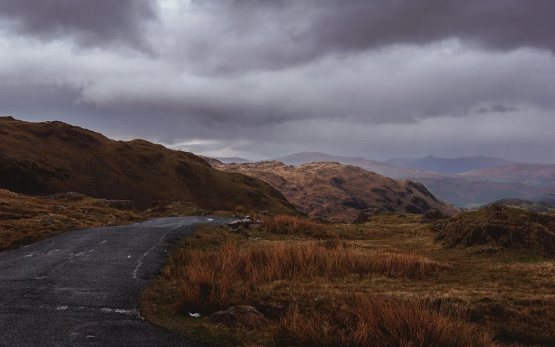 a road is on the side of a hill