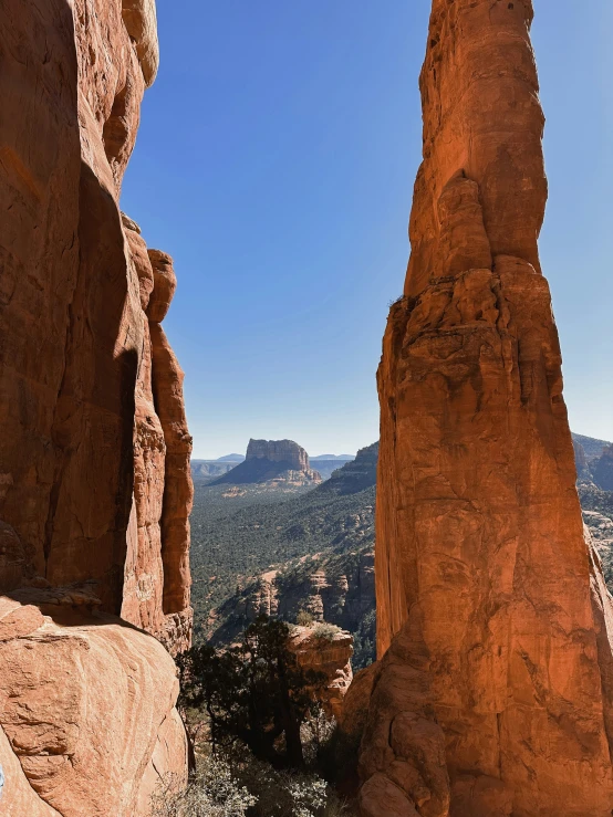 a mountain view with some rocks in the foreground