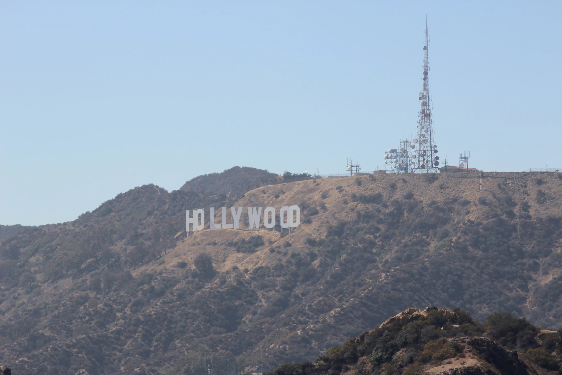 the hollywood sign is on top of a hill