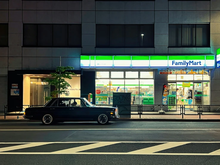 a car sits parked in front of a pharmacy