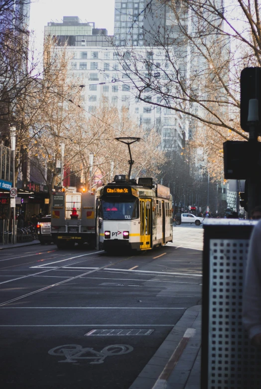 a city bus is traveling down the road