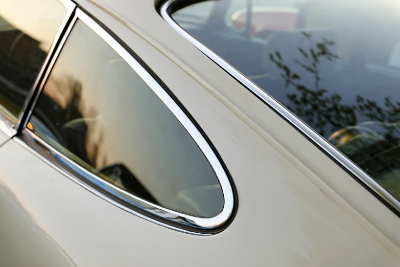 reflection of a car in the side window