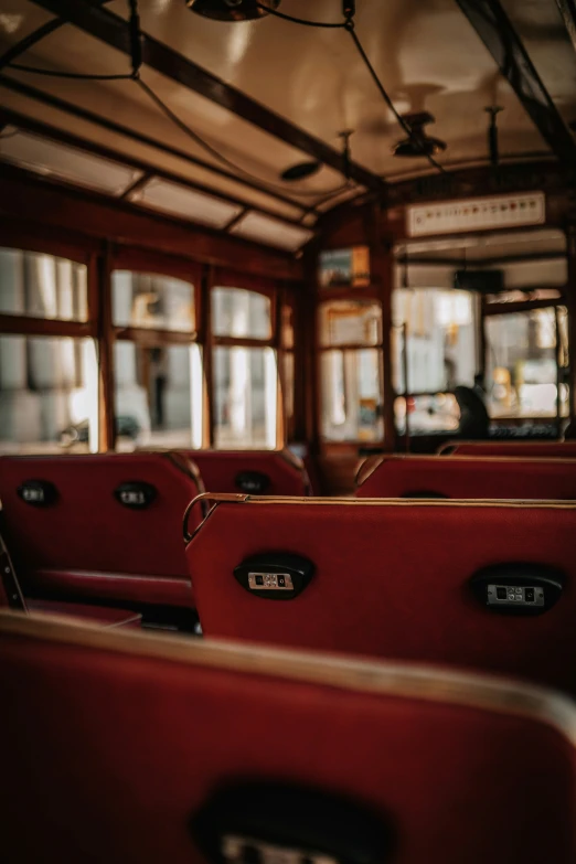 the inside of a metro car with empty seats