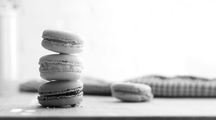 black and white pograph of three macaroons stacked on top of each other