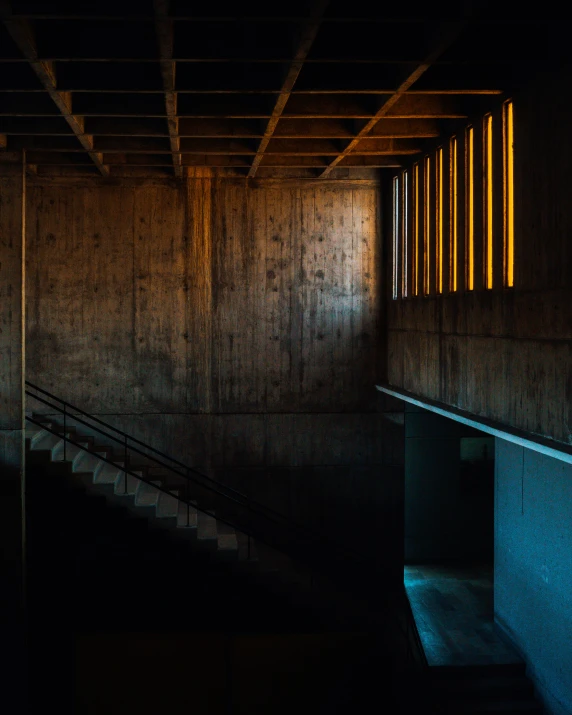 stairs and railing in a concrete structure in the dark