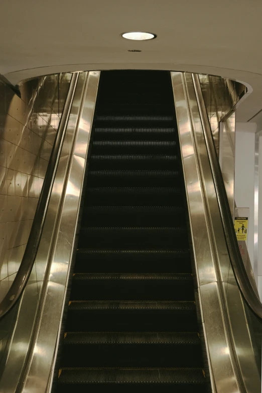 an escalator inside a subway station is empty