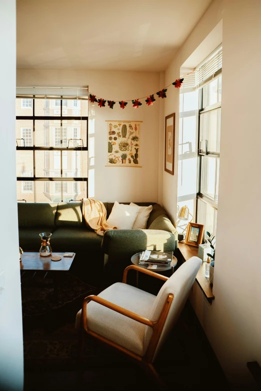 an empty living room has couches and a chair