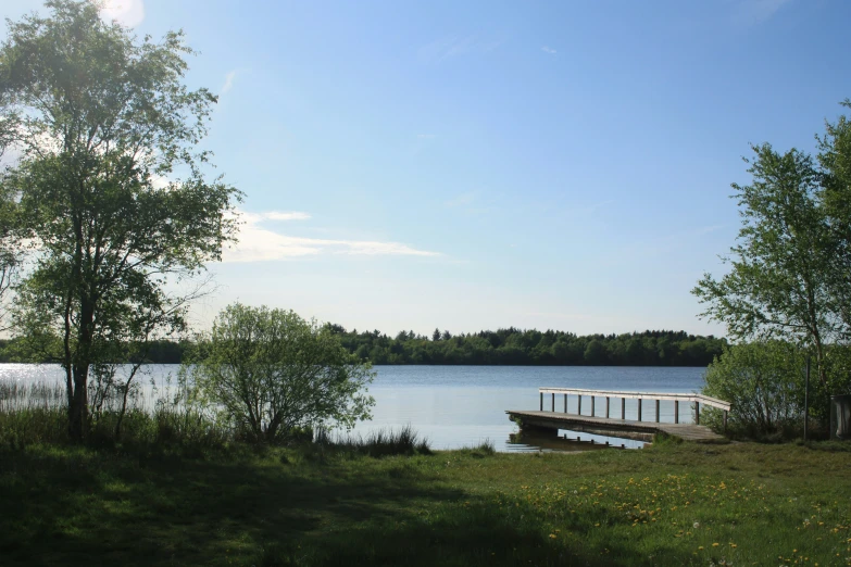 a bench sits beside a body of water