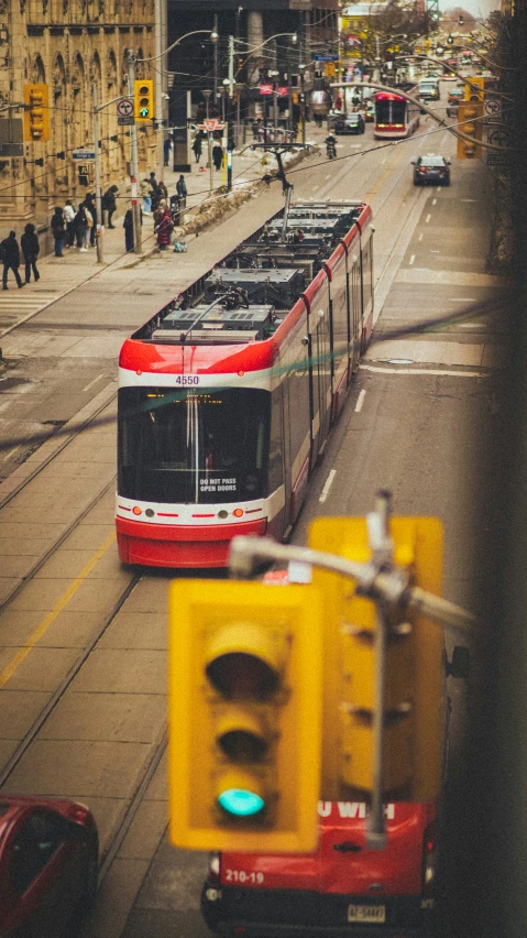 a train that is going down the street