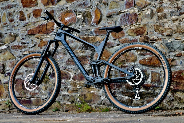 there is a bike parked next to a wall