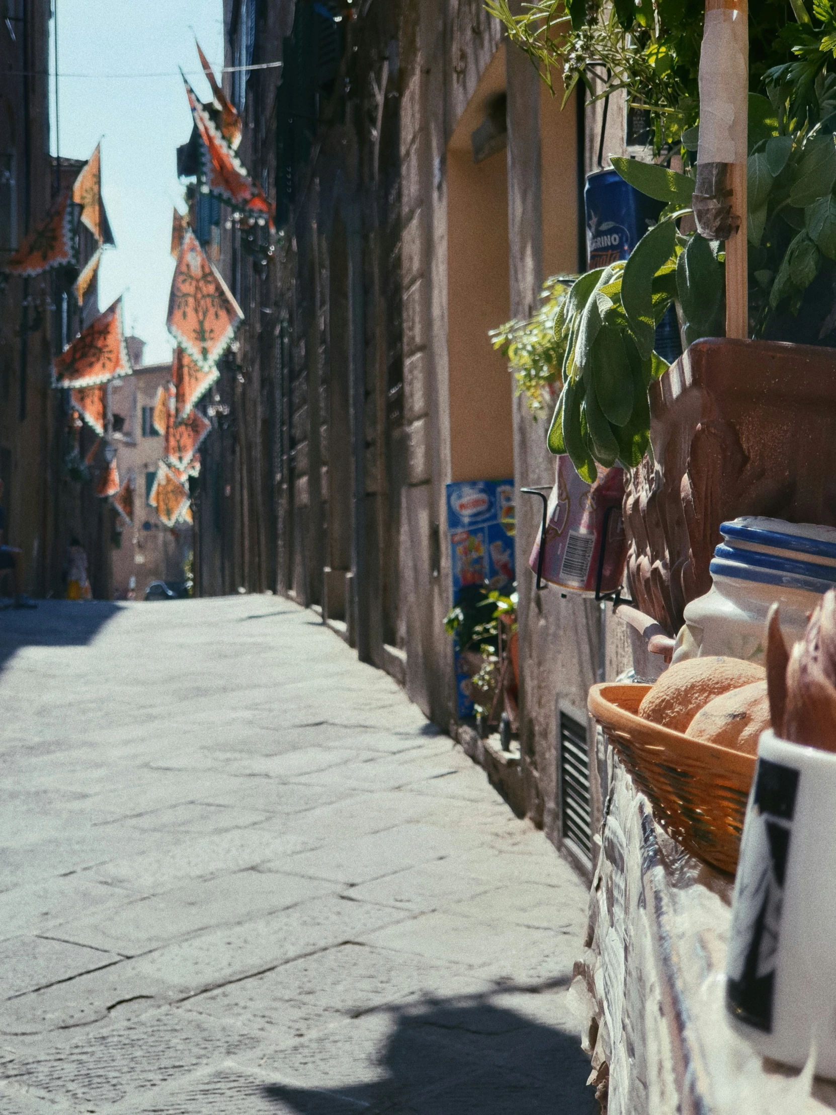 an old building with several baskets and food items outside