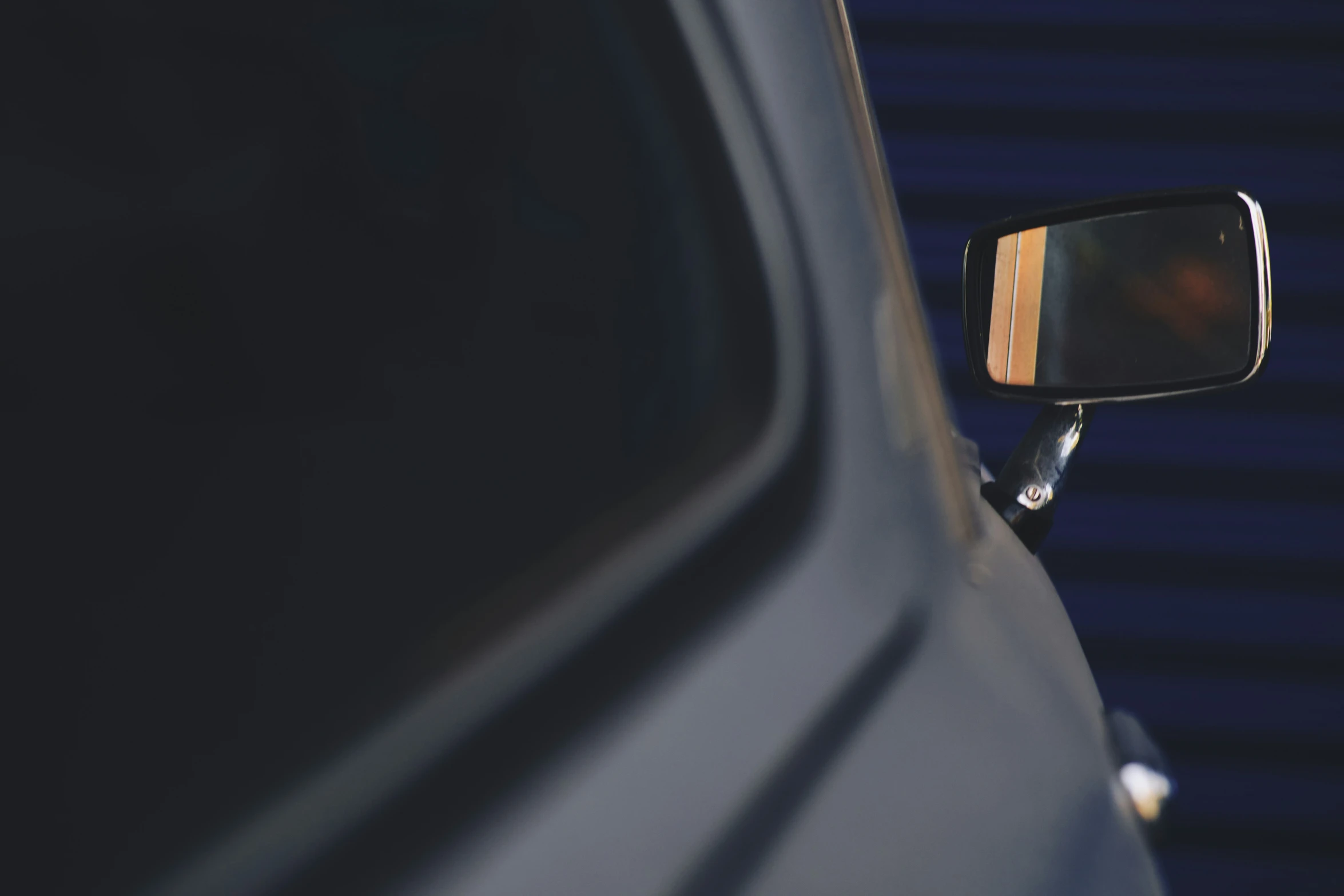 a side mirror of a vehicle is shown on a car