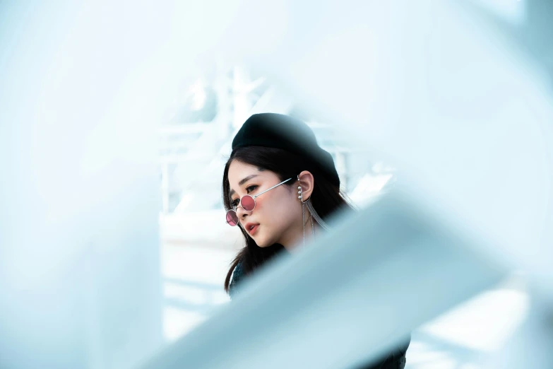 a woman looking into her mirrored mirror to see herself