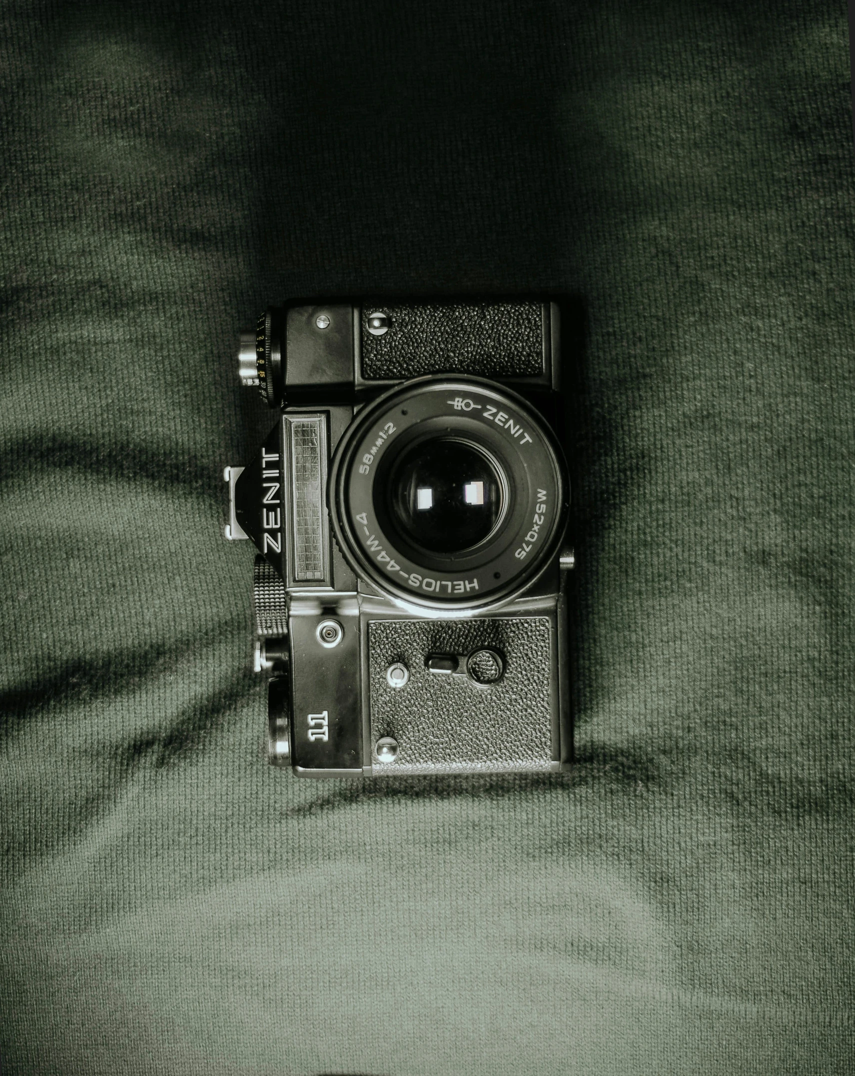 a camera sitting on top of a bed