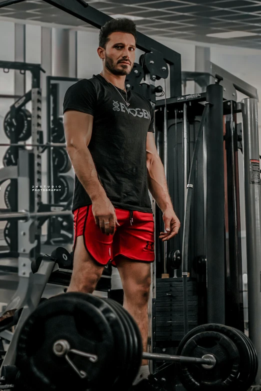 a man is standing next to a machine