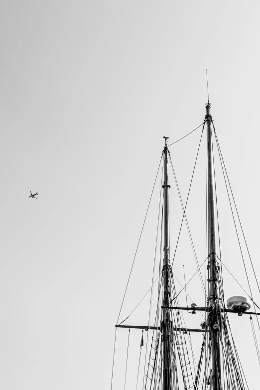 a black and white po of a sailboat in the air