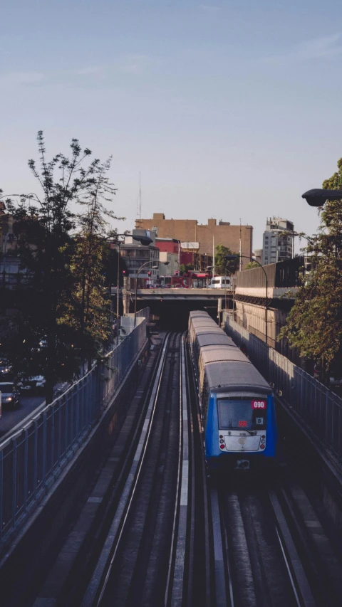 the train is moving along the railroad tracks