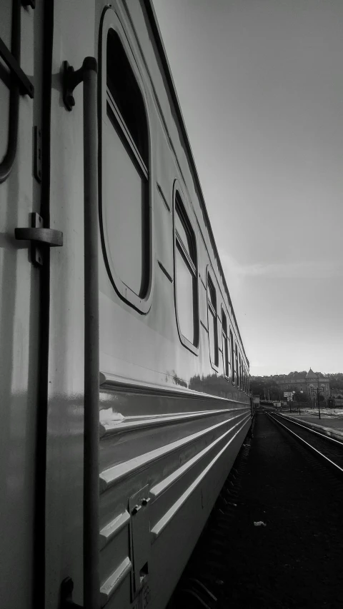 train on tracks passing through an open countryside