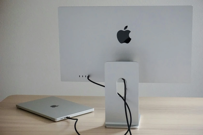 a apple computer and its packaging on a table