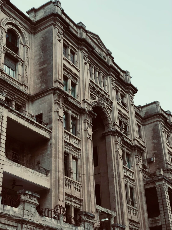 a large building with several balconies near it