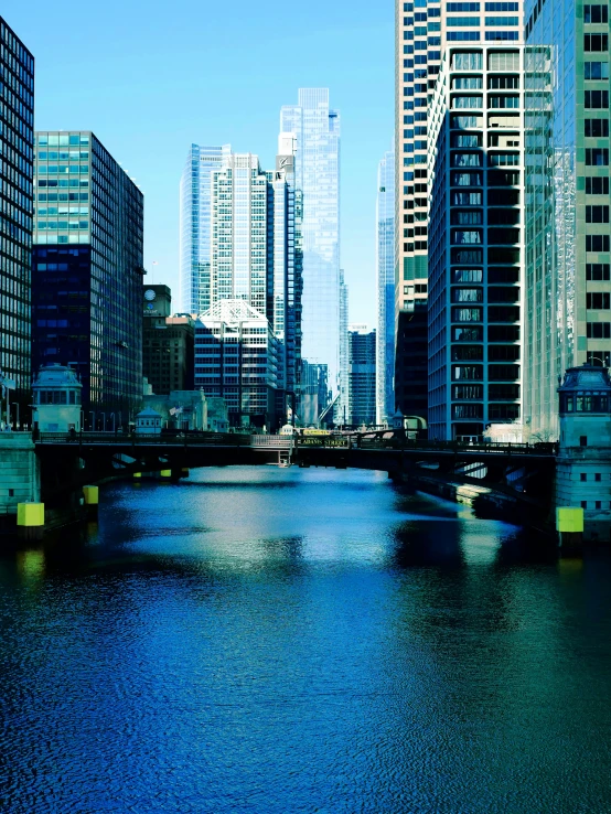 several large buildings on the other side of a river