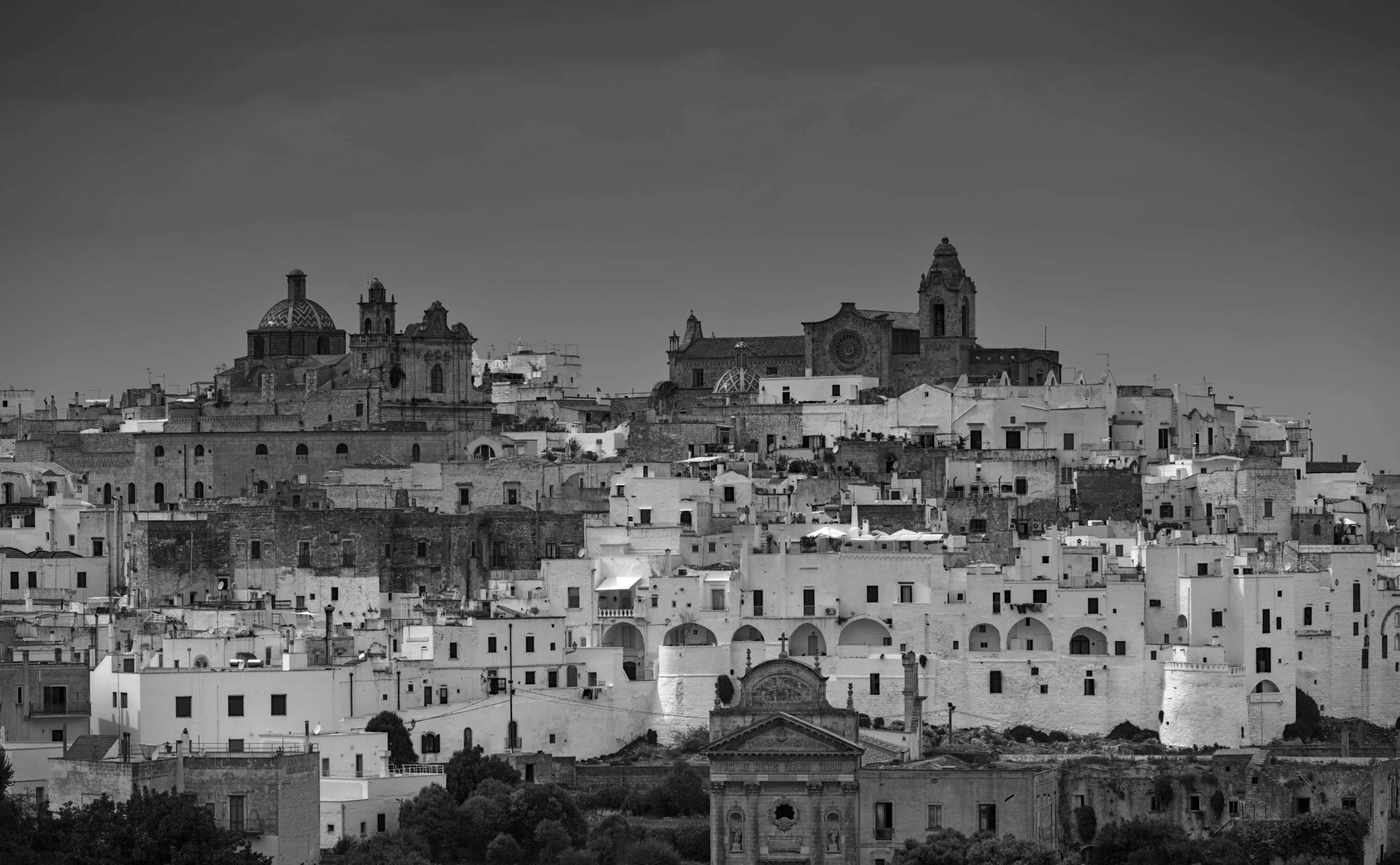 there are a lot of buildings on top of this hill