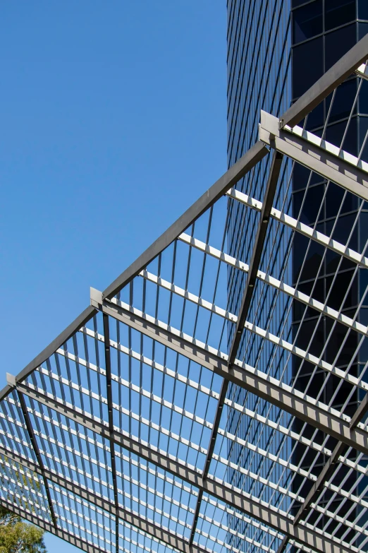 a high rise office building with modern architecture in the background